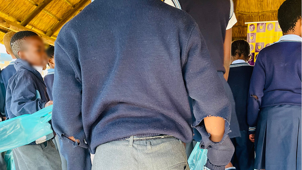 Students receiving Fudumala jersey packages